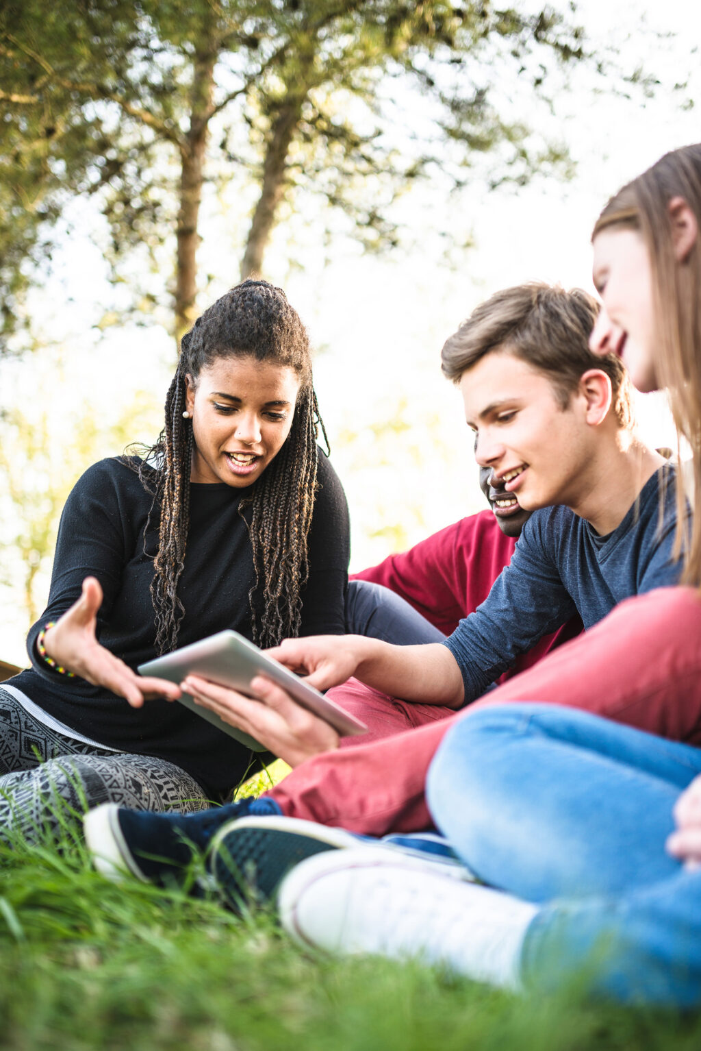 Students Sitting With Tablet