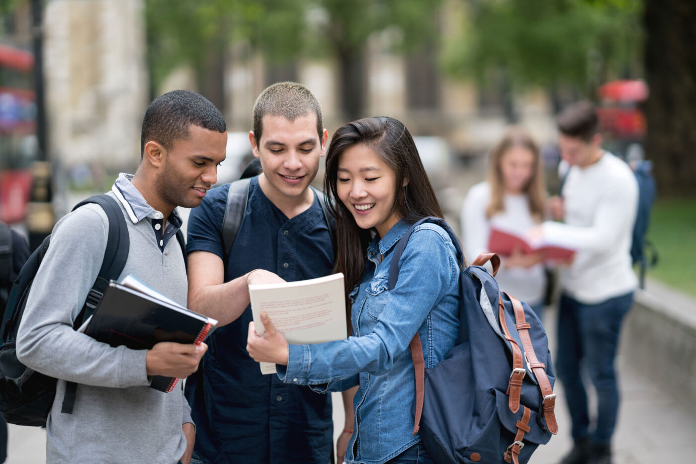 3 Students discussing book